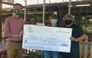 A group of people holding a check for 7 thousand dollars from the Oregon Community Foundation