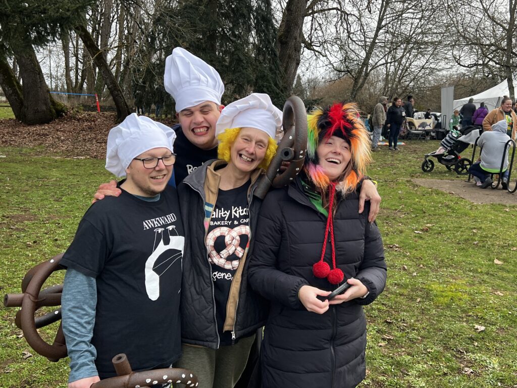 A group of Reality Kitchen team members standing outside and smiling.